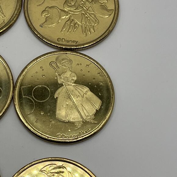 Set of 16 Walt Disney World 50th Anniversary Gold Medallion Coins USED AS IS - Picture 14 of 16